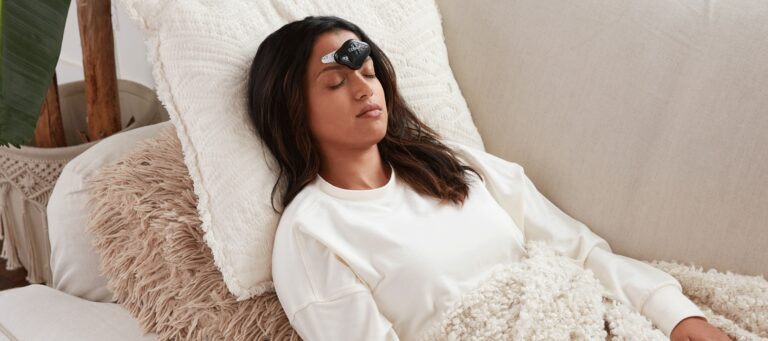 women laying down with cefaly connected device