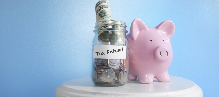 a pink piggy bank next to a jar of money that says "tax refund"