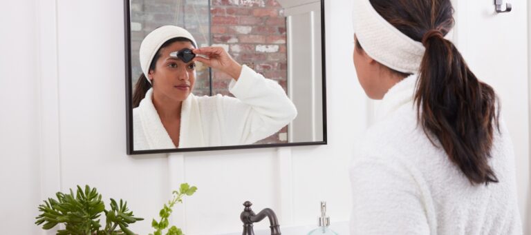 women putting cefaly device on